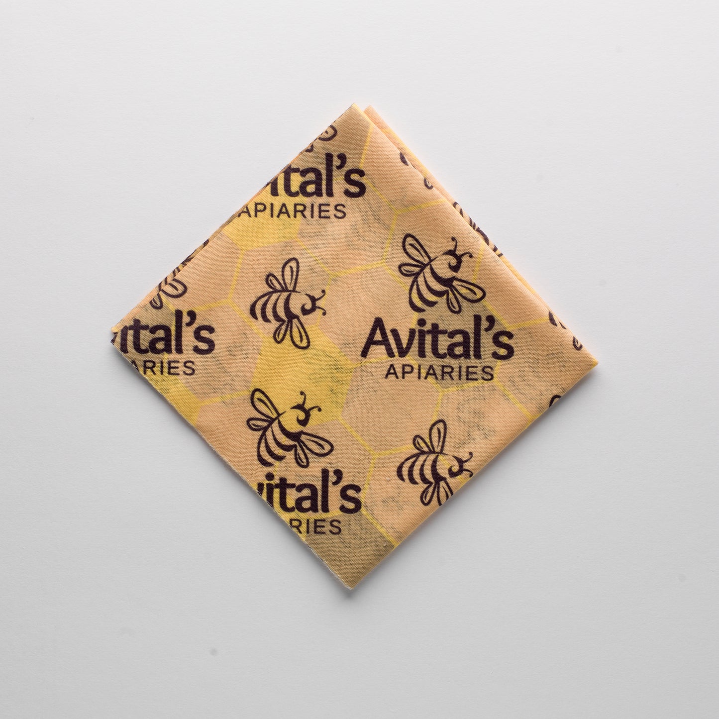 An Avital's bandana folded into a square and on a white background.