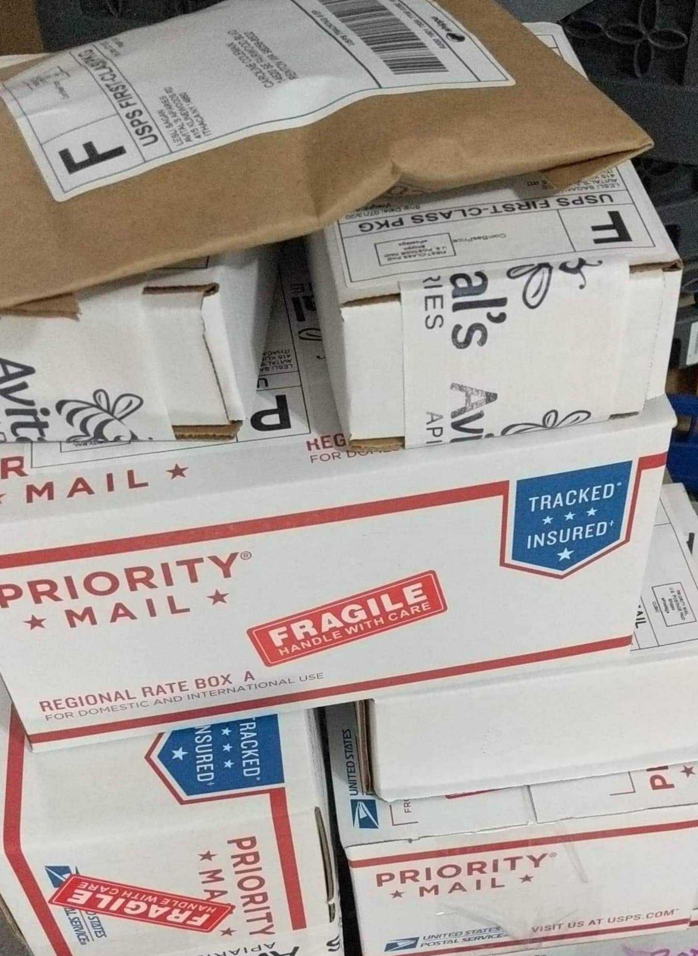 Pile of packages in USPS boxes