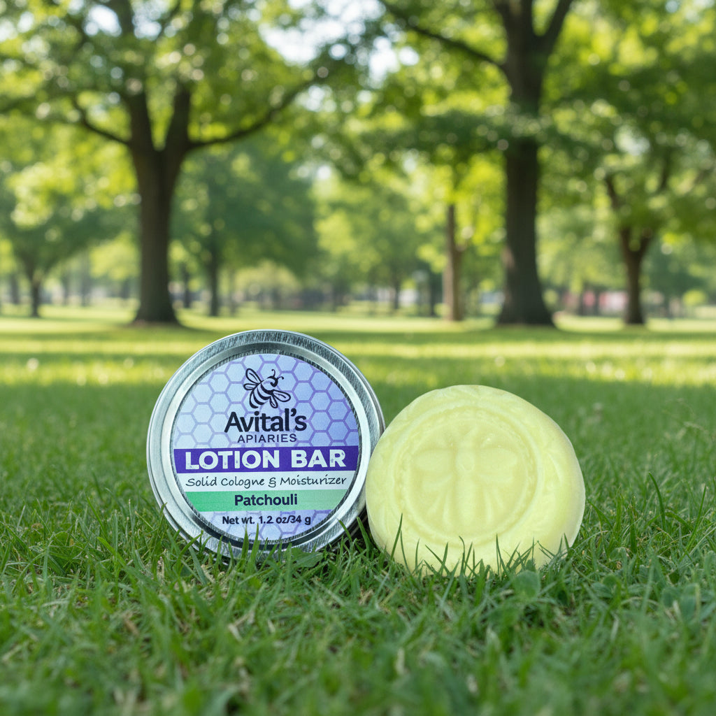 
                  
                    Avital's Apiaries lotion bar and container in a natural, park-like setting
                  
                