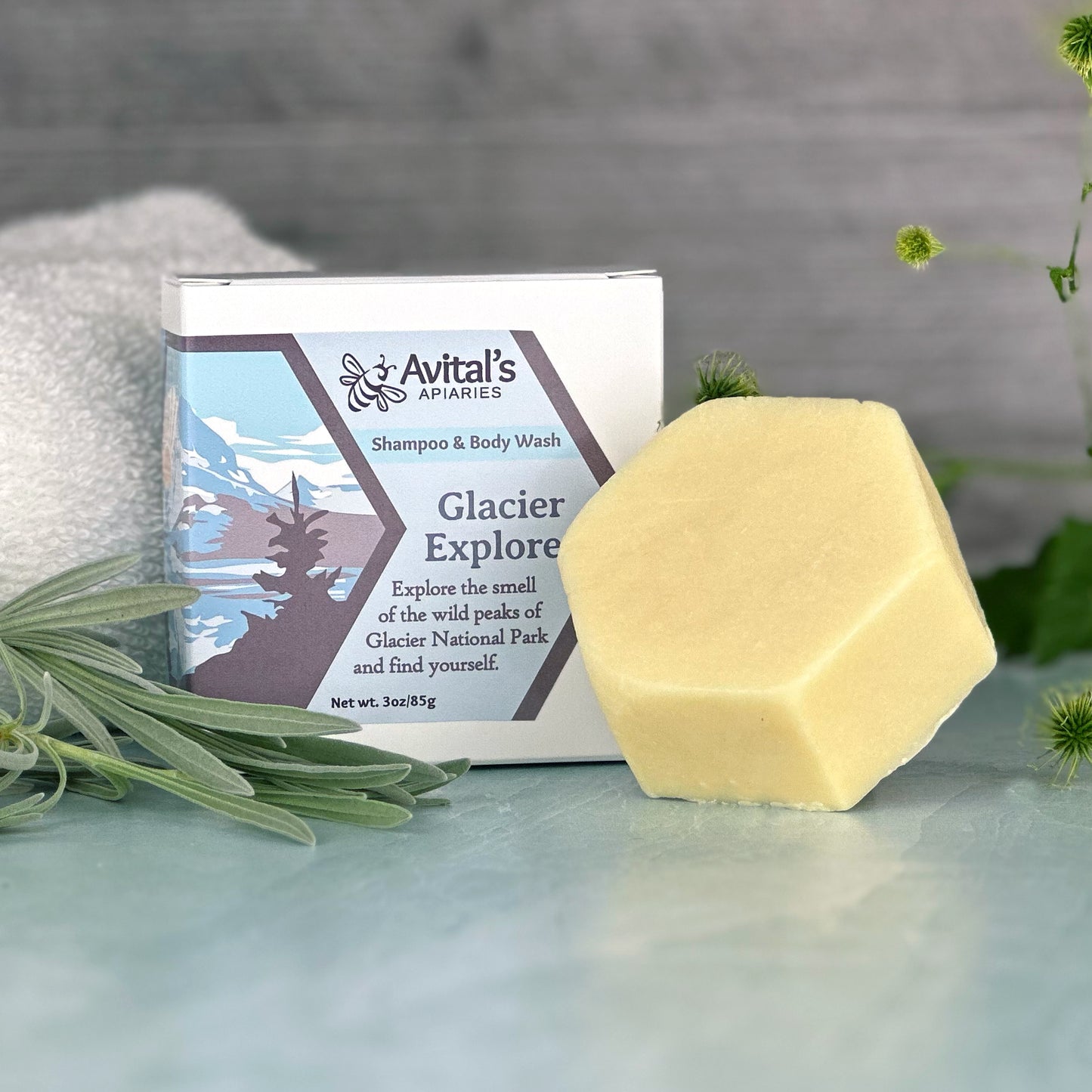 A pale yellow hexagonal bar next to a box that reads Glacier Explorer Shampoo & Body Wash