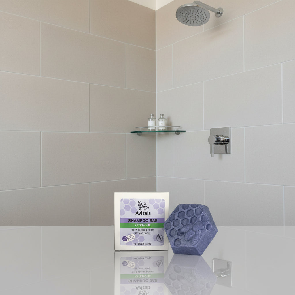 Avitals hexagonal shampoo bar on a ledge in a modern shower.
