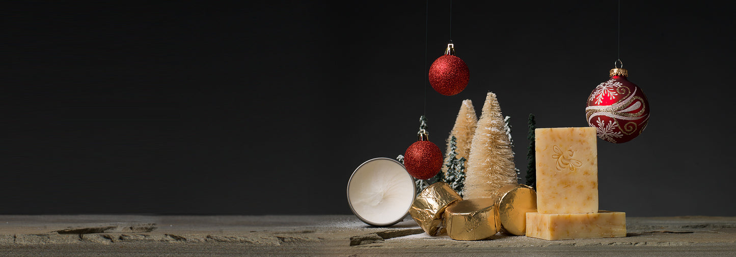 A Christmasy scene, complete with Chaya's Hope soap, model trees, and red ornaments.