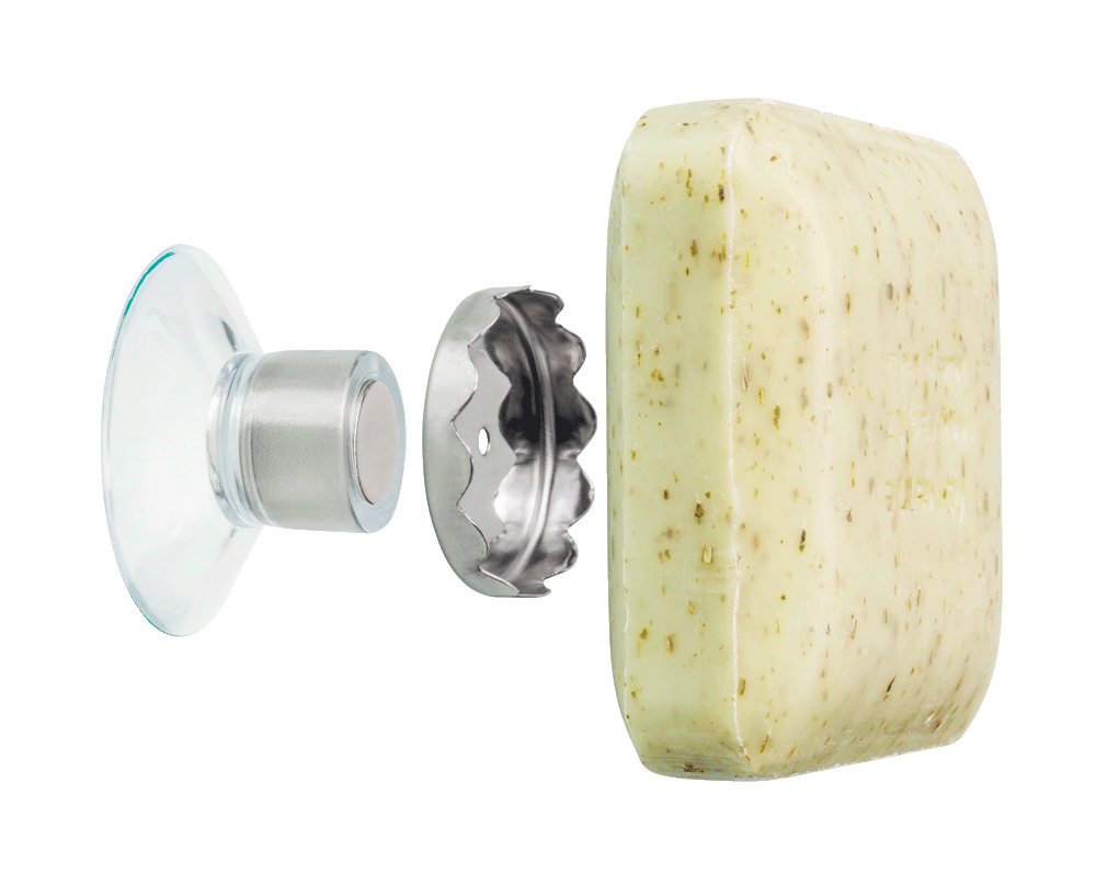 The suction cup, metal plate, and bar of soap showing the structure of the Savont Magnetic Soap Holder