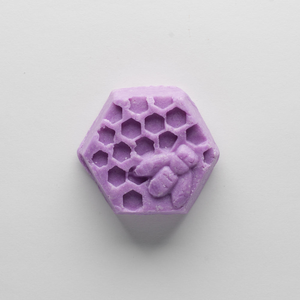 
                  
                    A purple hexagonal bar that depicts a honey bee on honey comb.
                  
                